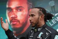 Mercedes driver Lewis Hamilton of Britain reacts after wining the Russian Formula One Grand Prix at the Sochi Autodrom circuit, in Sochi, Russia, Sunday, Sept. 26, 2021. (Yuri Kochetkov/Pool Photo via AP)