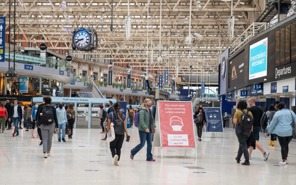 Commuters at Waterloo station after Boris Johnson urged those who can to work from home - PA