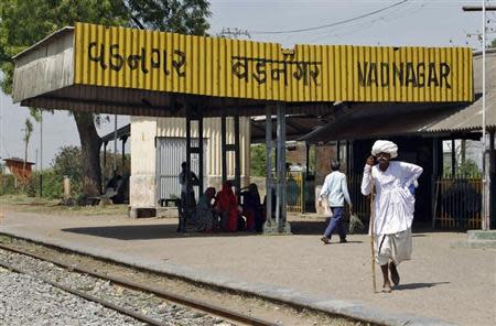 A man walks near Vadnagar railway station, March 26, 2014. REUTERS/Amit Dave