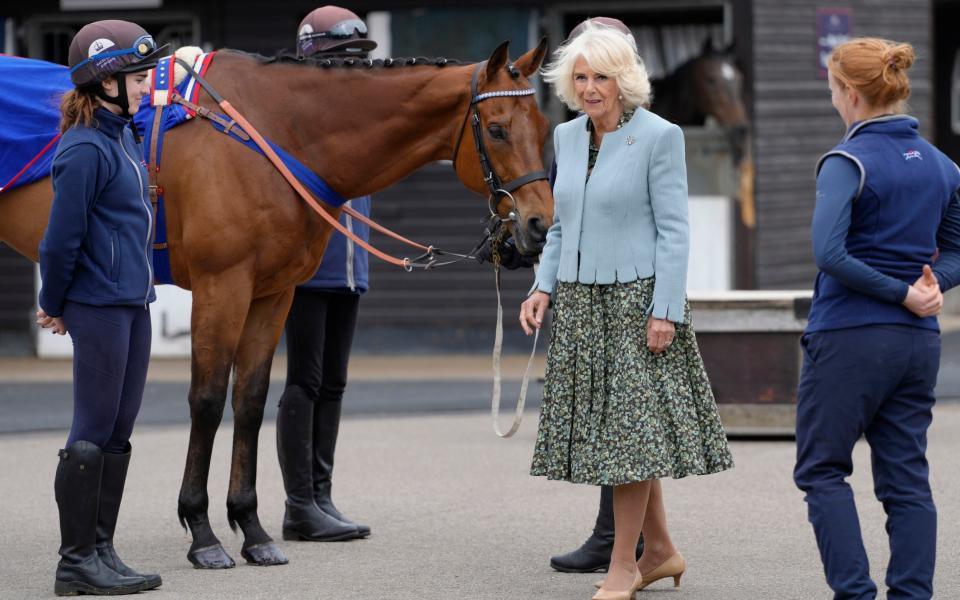 In a scallop-edged jacket at The British Racing School in Newmarket earlier this month - Kirsty Wigglesworth