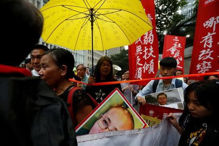 Protesters take part in a demonstration against a visit by Zhang Dejiang, the chairman of China's National People's Congress, in Hong Kong May 17, 2016. REUTERS/Bobby Yip