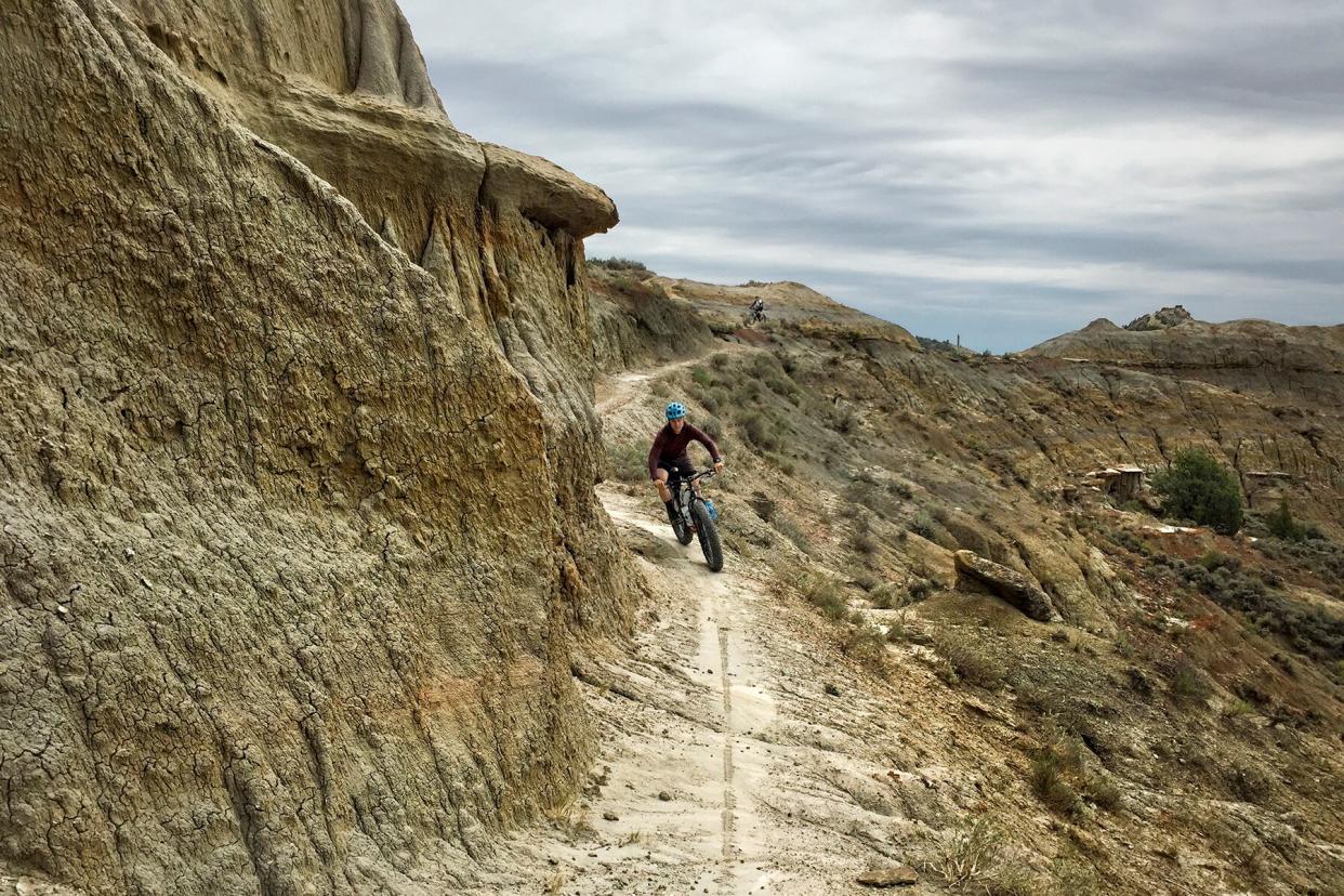 Man mountain bikes in North Dakota on the Maah Daah Hey trail