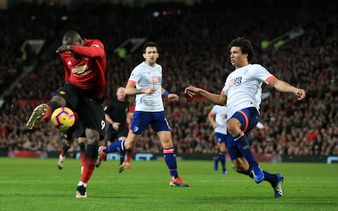 Romelu Lukaku of Man Utd scores their 4th goal past Nathan Ake of Bournemouth - Credit: Getty Images