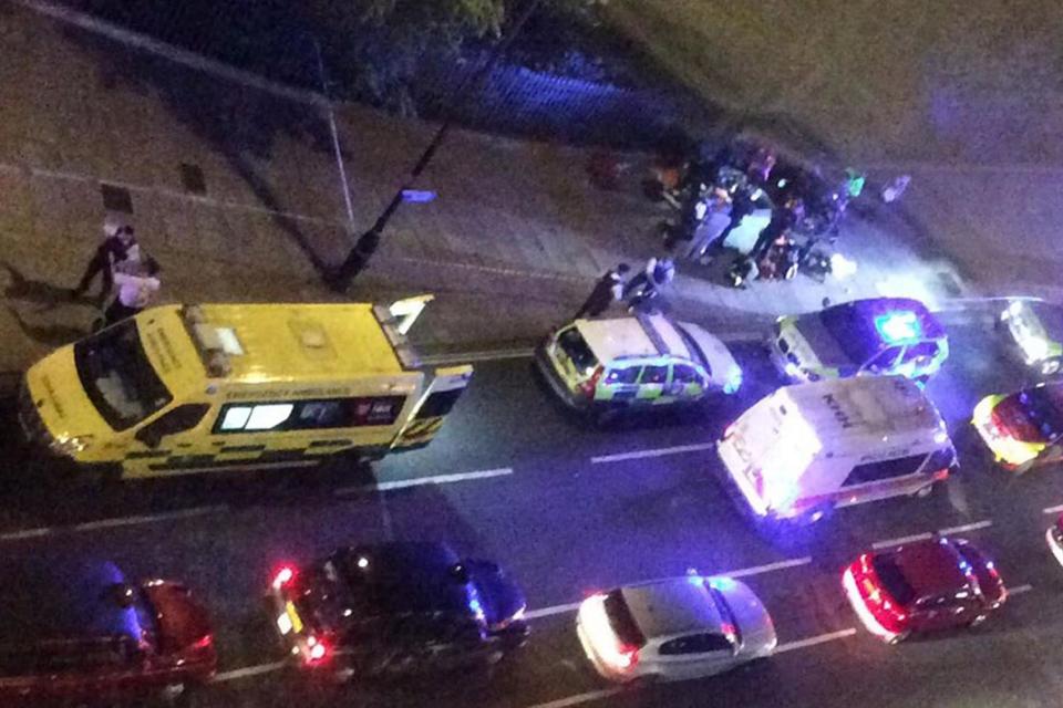 Police and ambulance crews at the scene in the aftermath of the stabbing rampage