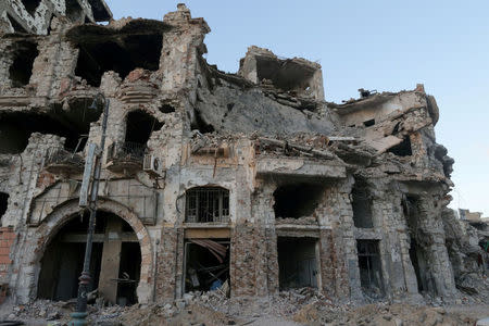 FILE PHOTO: A historic building, that was destroyed during a three-year conflict, is seen in Benghazi, Libya February 28, 2018. REUTERS/Esam Omran Al-Fetori/File Photo