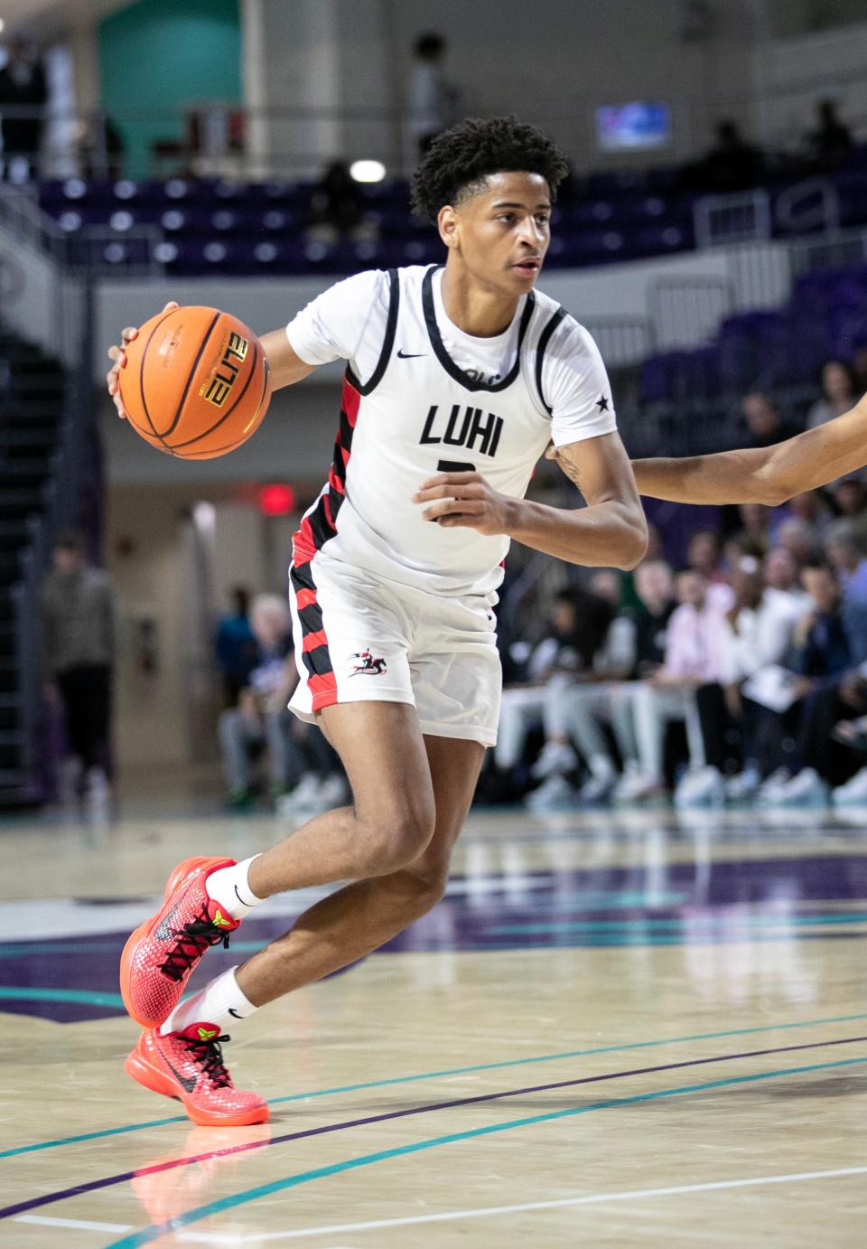 Kiyan Anthony of Long Island Lutheran drives toward the basket against Westminster Academy in the City of Palms Classic on Tuesday, Dec. 19, 2023, at Suncoast Credit Union Arena in Fort Myers.