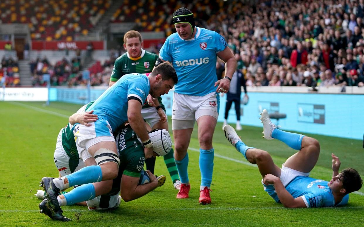 London Irish's Matt Rogerson (white cap) scores his side's third try during the Gallagher Premiership match at the Brentford Community Stadium, London. - PA