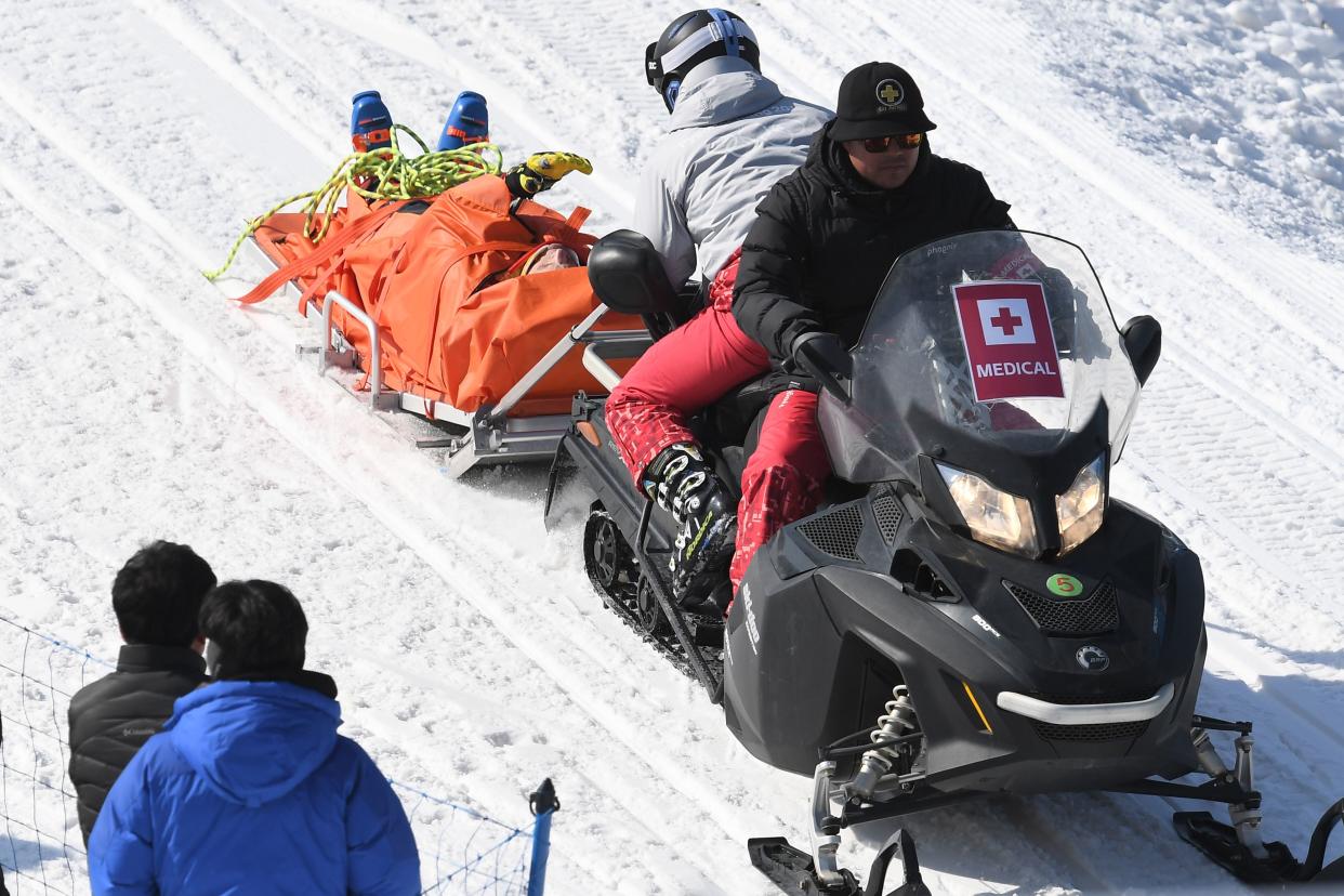 Christopher Del Bosco is transported off the hill on Wednesday. (Getty Images)