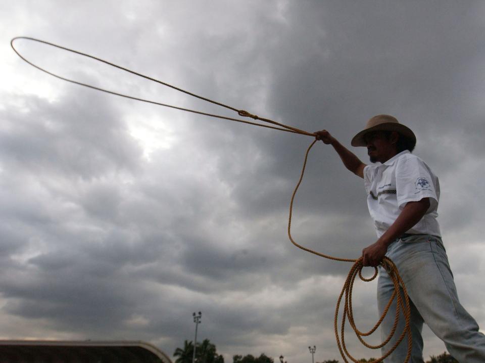 A Filipino cowboy practices with a lasso