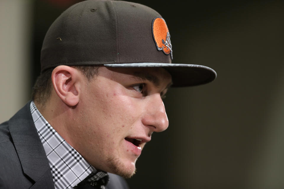 Cleveland Browns quarterback Johnny Manziel answers questions at his introductory news conference at the NFL football team's facility in Berea, Ohio Friday, May 9, 2014. Cleveland Browns quarterback Johnny Manziel, from Texas A&M, answers questions at his introductory news conference at the NFL football team's facility in Berea, Ohio Friday, May 9, 2014. The Browns selected Manziel 22nd overall in the first round in Thursday's NFL draft, after taking Oklahoma State cornerback Justin Gilbert with the eighth pick. (AP Photo/Mark Duncan)(AP Photo/Tony Dejak)