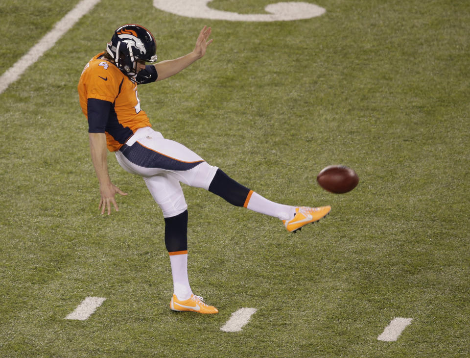 Denver Broncos' Britton Colquitt punts the ball against the Seattle Seahawks during the first half of the NFL Super Bowl XLVIII football game Sunday, Feb. 2, 2014, in East Rutherford, N.J. (AP Photo/Charlie Riedel)