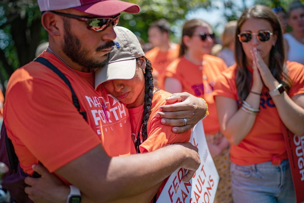 Felix and Kimberly Rubio who lost their daughter Lexi during the Robb Elementary School mass shooting embrace as they join activist, family and friends of the victims of the Highland Park and Uvalde mass shooting rallied near the U.S. Capitol Hill in Washington, D.C., Wednesday, July 13, 2022.