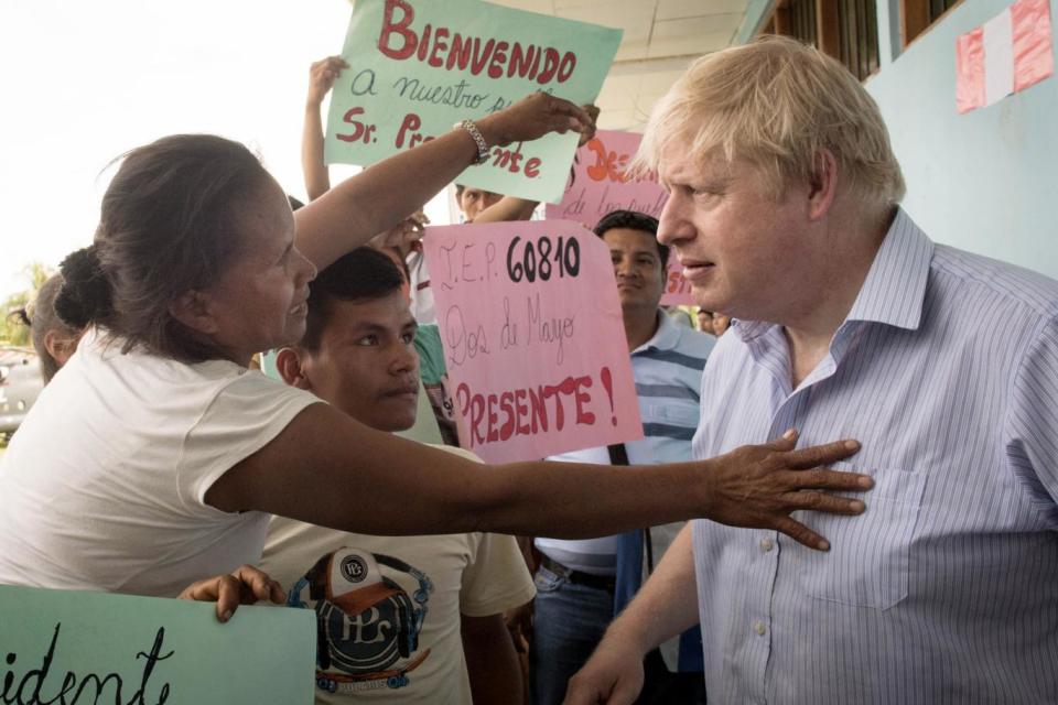 Foreign Secretary Boris Johnson meets pupils, parents and staff during a visit to the village school in Santa Marta (PA)