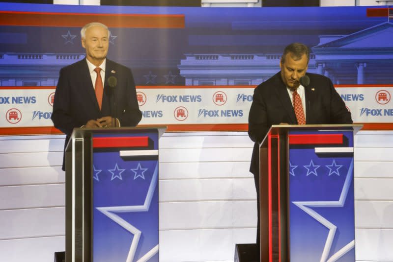 Republican presidential candidate Asa Hutchinson (L) and Republican presidential candidate Chris Christie take part in the first Republican presidential candidate debate that was held at the Fiserv Forum in Milwaukee, Wis., on Wednesday. Photo by Tannen Maury/UPI