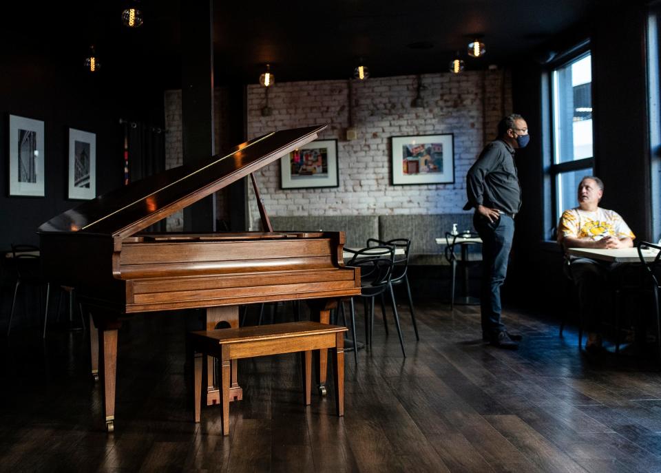 Owner J.D. Simpson talks to a customer at SavannahBlue in downtown Detroit, Wednesday, Oct. 7, 2020.