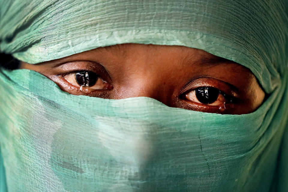 FILE- F, 22, who says she was raped by members of Myanmar's armed forces in June and again in September, is photographed Wednesday, Nov. 22, 2017, in her tent in Kutupalong refugee camp in Bangladesh. Judges at the International Court of Justice rule Friday July 22, 2022, on whether a case brought by Gambia alleging that Myanmar is committing genocide against the Rohingya can go ahead. Myanmar argues that the court does not have jurisdiction. (AP Photo/Wong Maye-E, file)