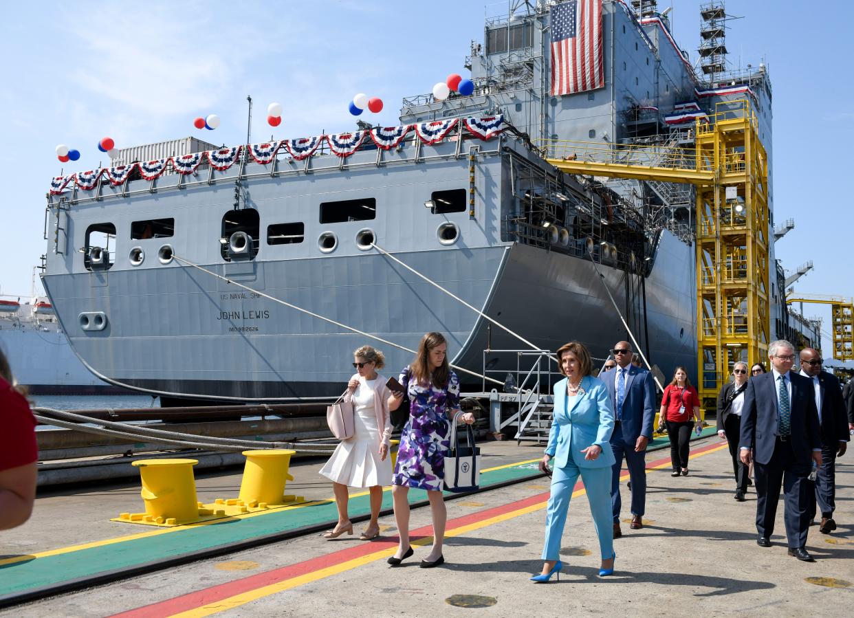 Speaker of the House Nancy Pelosi walks past the USNS John Lewis after a christening ceremony Saturday in San Diego. (AP Photo/Denis Poroy)