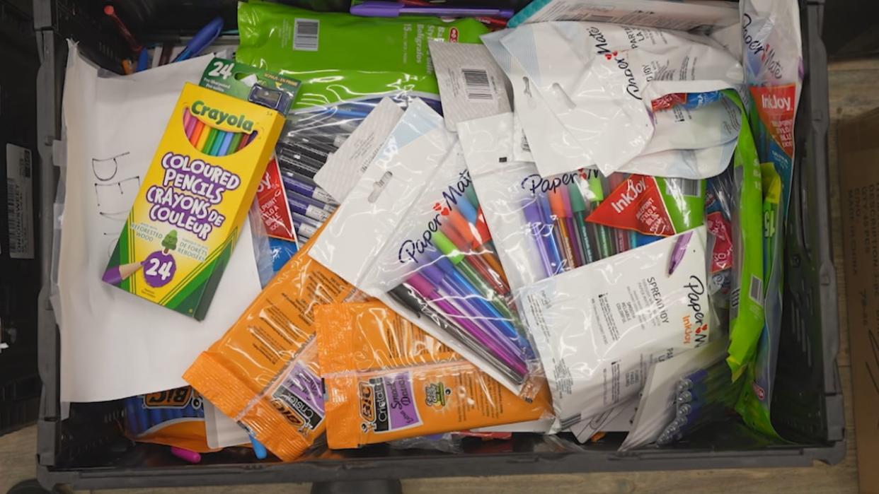 Pens, pencil crayons, markers and more — parents are shopping for back-to-school items and some have seen prices rise. The Guru Nanak Food Bank has collected boxes and boxes of those items in during a school supply drive. (Maggie MacPherson/CBC - image credit)