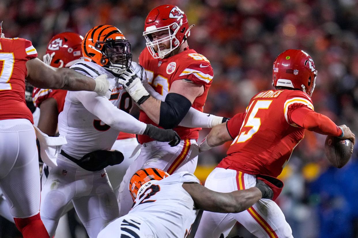 Bengals defensive end Joseph Ossai and defensive tackle BJ Hill wrap up Kansas City Chiefs quarterback Patrick Mahomes.