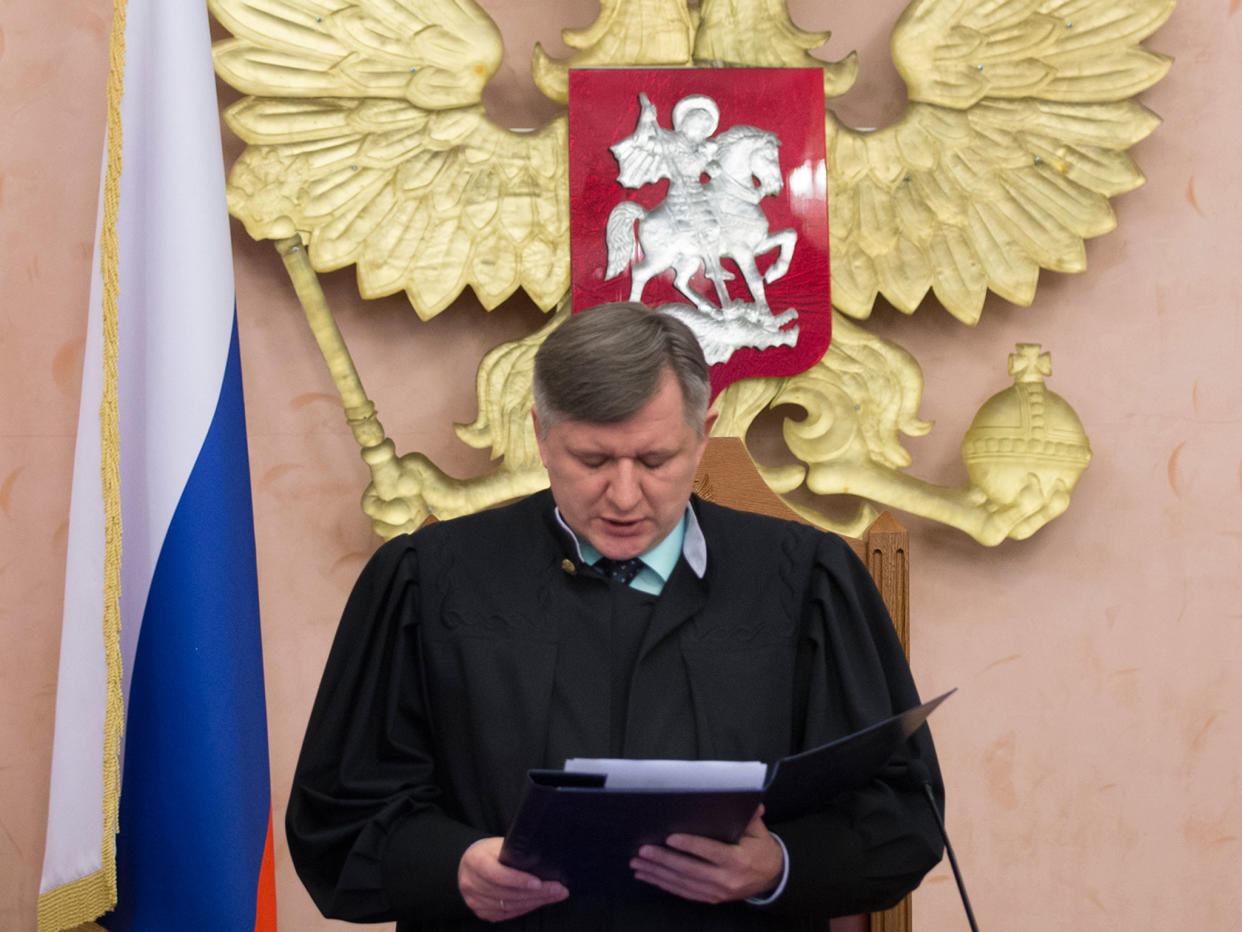 Supreme Court judge Yuri Ivanenko reads the decision in a courtroom in Moscow Thursday: AP