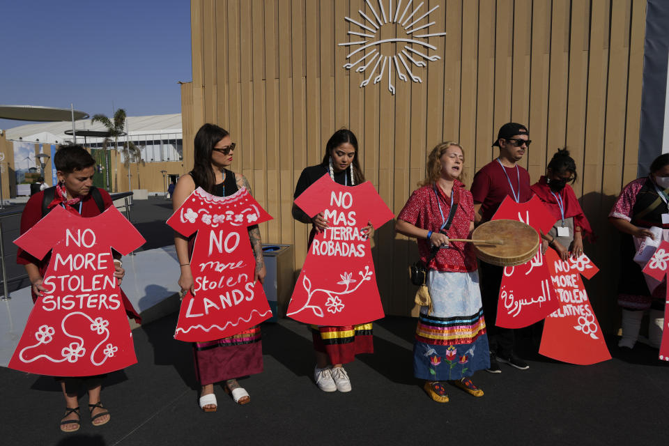 Demonstrators hold signs as part of a protest demanding no more stolen relatives and stolen land with the group Indigenous Women Action at the COP27 U.N. Climate Summit, Tuesday, Nov. 15, 2022, in Sharm el-Sheikh, Egypt. (AP Photo/Peter Dejong)