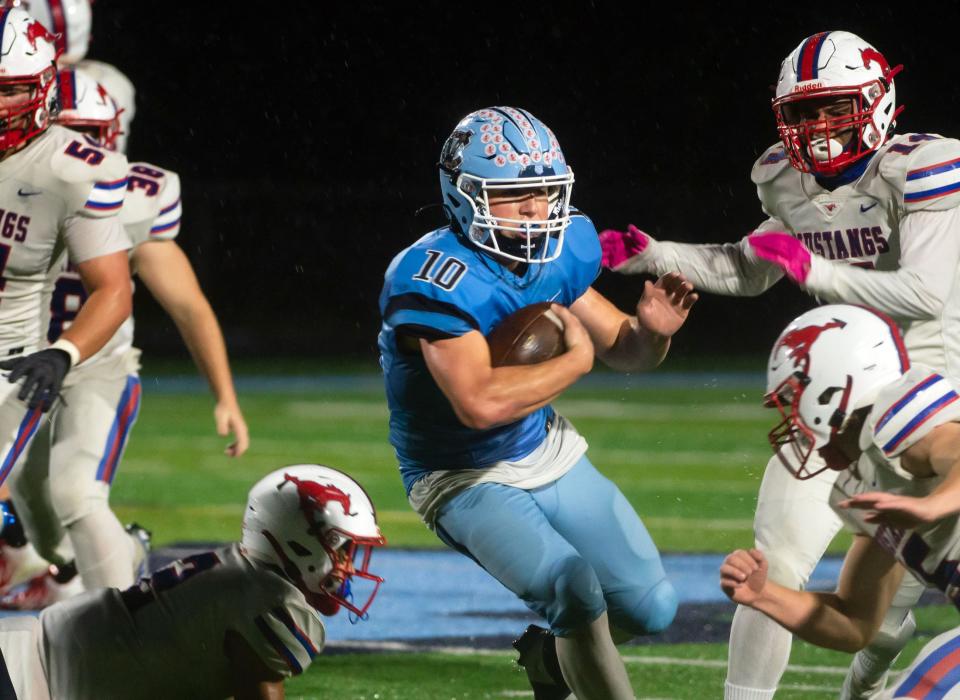 Central Valley's Bret FitzSimmons plows through the Laurel Highlands defense to help the Warriors win 36-7 in their WPIAL quarterfinal game Friday at Central Valley High School. [Lucy Schaly/For BCT]