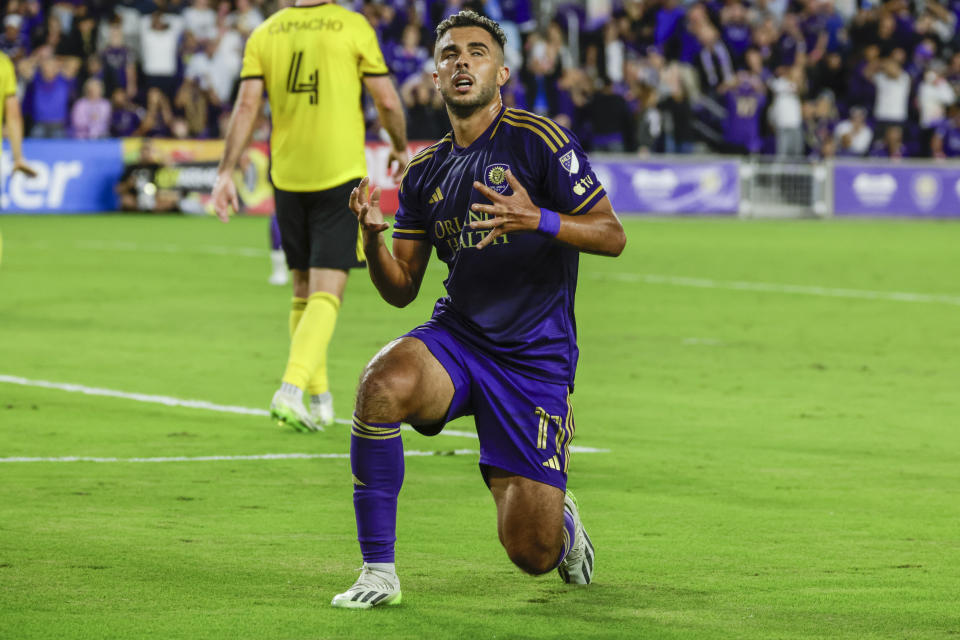 Orlando City forward Facundo Torres, 17, reacts after he misses shoot on goal during the second half of an MLS soccer playoff match, Saturday, Nov. 25, 2023, in Orlando, Fla. (AP Photo/Kevin Kolczynski)