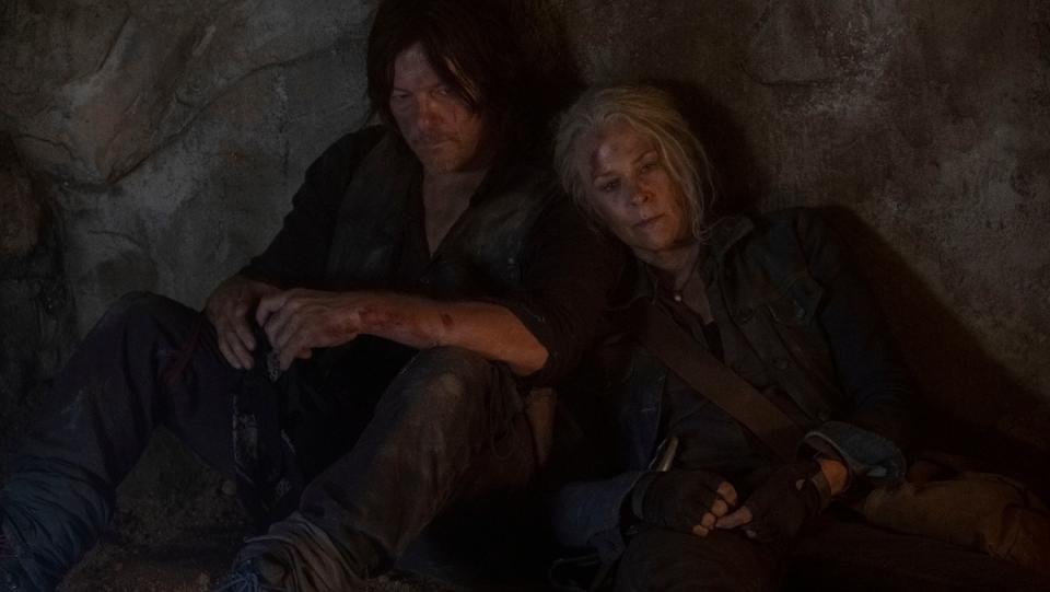 The Walking Dead Carol and Daryl sit in a cave