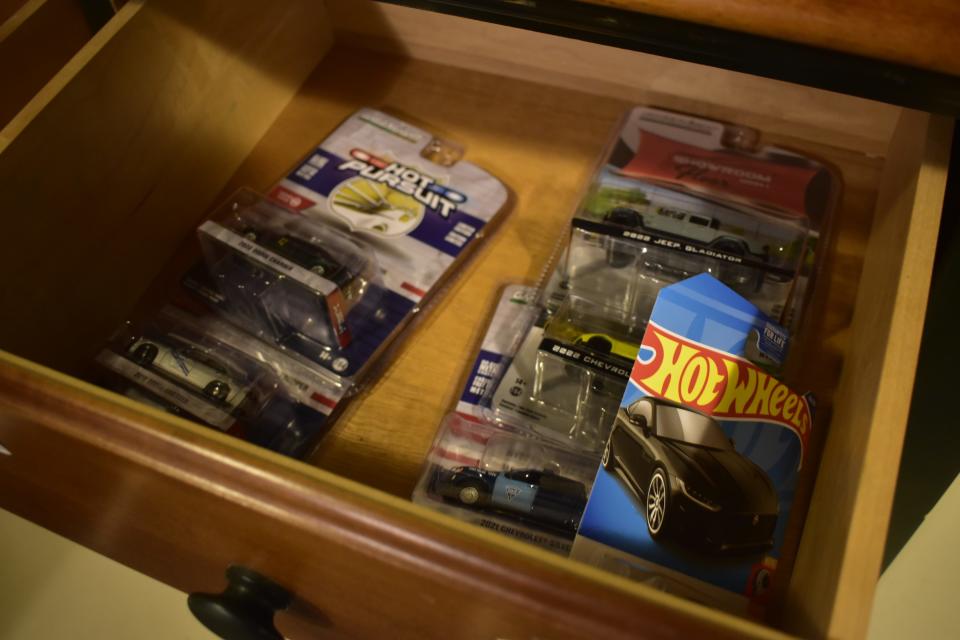 Alex Tanford has some cars still in the package and stashed away in drawers waiting to be displayed.