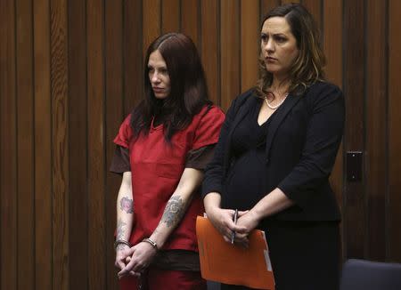 Alix Catherine Tichelman (L) stands in the courtroom with her attorney, Athena Reis, during her arraignment in Santa Cruz, California July 16, 2014. REUTERS/Robert Galbraith