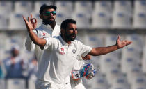 Cricket - India v England - Third Test cricket match - Punjab Cricket Association Stadium, Mohali, India - 27/11/16. India's Mohammed Shami and Virat Kohli (L) celebrate the dismissal of England's Adil Rashid. REUTERS/Adnan Abidi