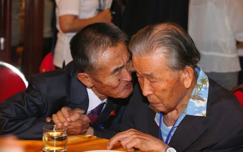 South Korean Lee Moon-hyuk, 95, meets his North Korean nephew Ri Kwan Hyuk, 80 - Credit: AFP