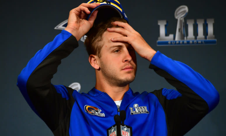 Los Angeles Rams QB Jared Goff wipes his forehead at Super Bowl media day.