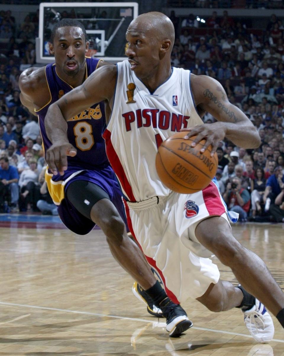 Detroit Pistons' Chauncey Billups drives past the defense of Los Angeles Lakers' Kobe Bryant during the third quarter in Game 4 of the NBA Finals, Sunday, June 13, 2004, at the Palace of Auburn Hills.