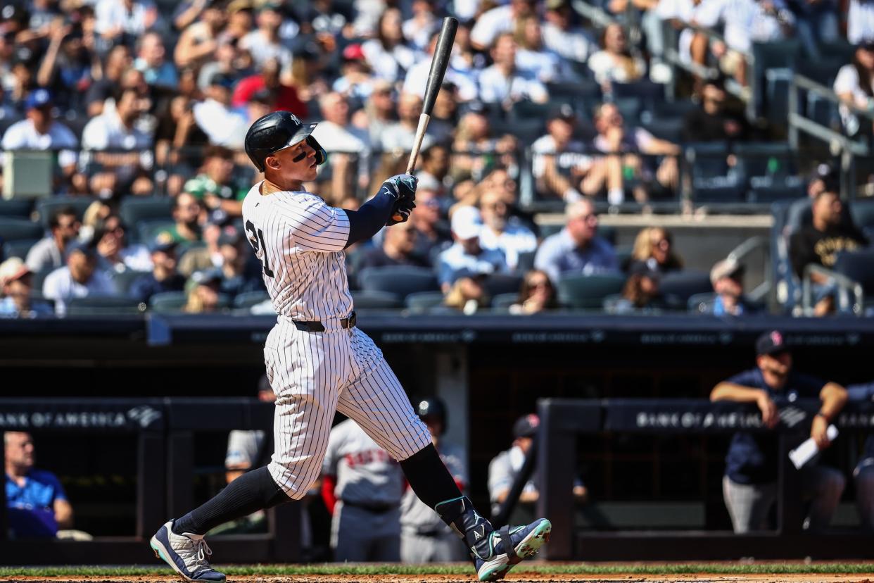 Sep 15, 2024; Bronx, New York, USA; New York Yankees center fielder Aaron Judge (99) hits a two-run home run in the third inning against the Boston Red Sox at Yankee Stadium. Mandatory Credit: Wendell Cruz-Imagn Images