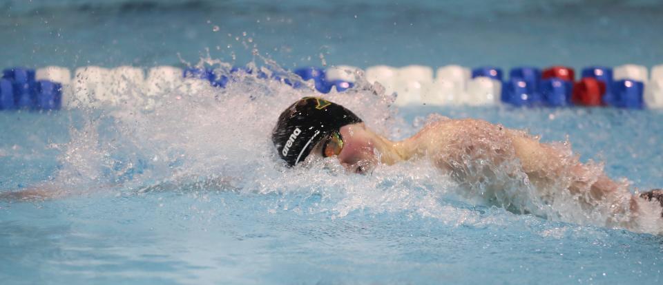 St. Xavier’s Alex Thiesing races and wins the 200 freestyle Friday at the KHSAA State Championships.