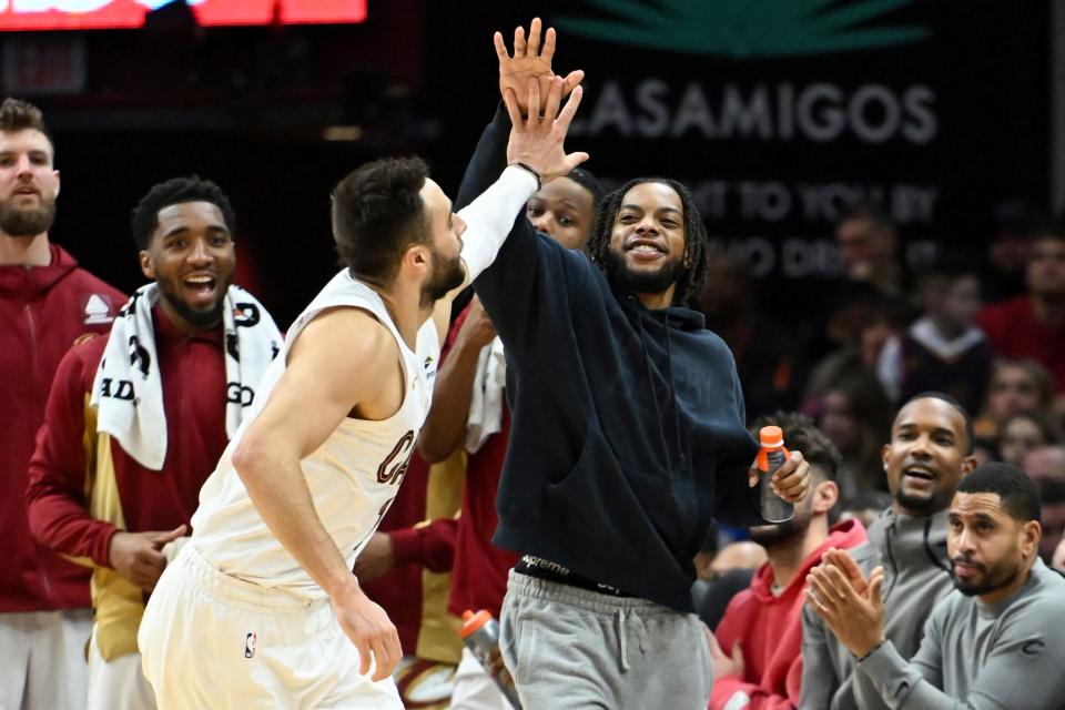 Cleveland Cavaliers' Darius Garland, center right, and Georges Niang, front left, celebrate after a 3-pointer by Niang against the Washington Wizards on Jan. 5 in Cleveland.