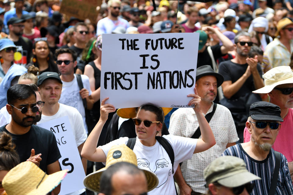 Protesters are seen during the Invasion Day rally in Melbourne.