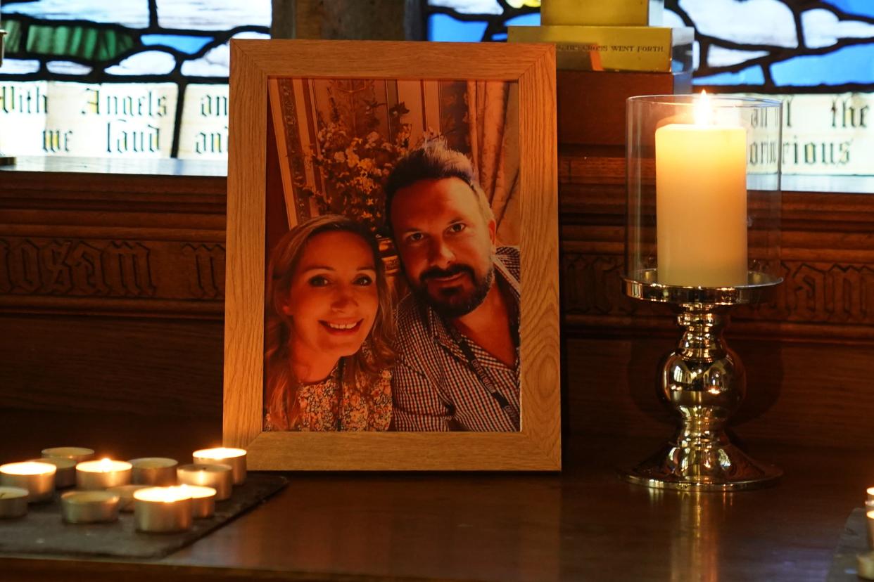 Candles are lit around a photo of Nicola Bulley and her partner Paul Ansell on an altar at St Michael’s Church in St Michael’s on Wyre, Lancashire (Owen Humphreys/PA) (PA Wire)