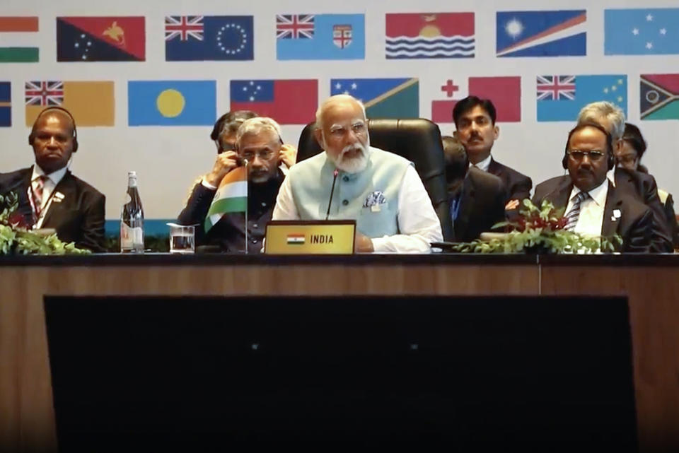 In this image made from video, Indian Prime Minister Narendra Modi, center, addresses a meeting with Pacific Island leaders to discuss ways to better cooperate in Port Moresby, Papua New Guinea, Monday, May 22, 2023. (Australian Broadcasting Corp. via AP)