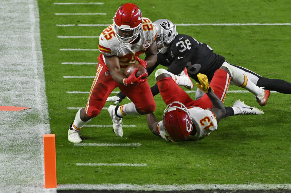 Kansas City Chiefs running back Clyde Edwards-Helaire (25) runs for a touchdown against Las Vegas Raiders strong safety Jeff Heath (38) during the second half of an NFL football game, Sunday, Nov. 22, 2020, in Las Vegas. (AP Photo/David Becker)