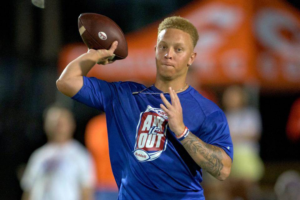 FILE - South Carolina quarterback Spencer Rattler throws at the Manning Passing Academy on the Nicholls State University campus in Thibodaux, La. on June 24, 2022. Revamped South Carolina, led by Oklahoma transfer Spencer Rattler, prepare to open fall camp and show that last year's winning season in coach Shane Beamer's debut season wasn't a fluke.  (AP Photo/Matthew Hinton, File)