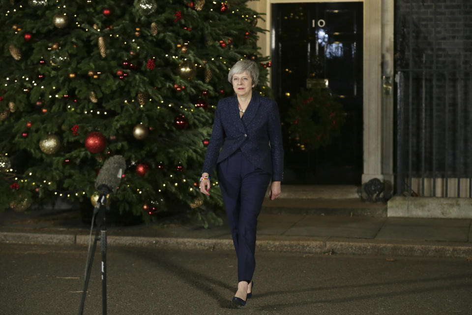 British Prime Minister Theresa May walks from 10 Downing Street to make a statement, in London, Wednesday December 12, 2018. (AP Photo/Tim Ireland)