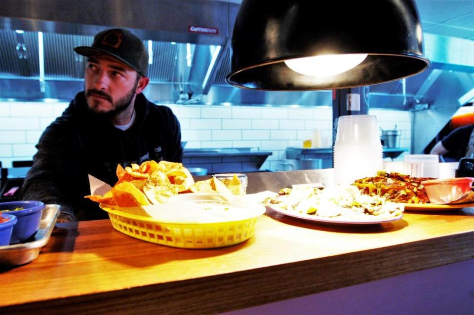 Chef Jake Wood in the kitchen at his restaurant, Lawrence BBQ, located in the new Boxyard RTP on Friday, Dec. 3, 2021.