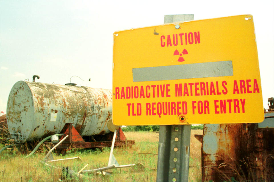 A sign warns visitors to keep away from a pile of radioactive debris stored on the grounds of the uranium-enrichment Paducah Gaseous Diffusion Plant on Thursday, August 12, 1999 near Paducah, Ky.  (Photo: Billy Suratt via Getty Images)