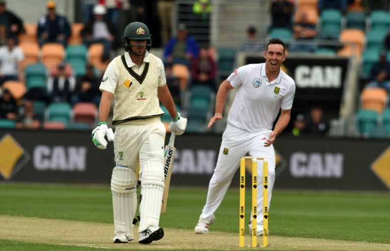 South Africa's Kyle Abbott (R) celebrates his first wicket of Australia's Joe Burns on the third day's play of their second Test, in Hobart, on November 14, 2016