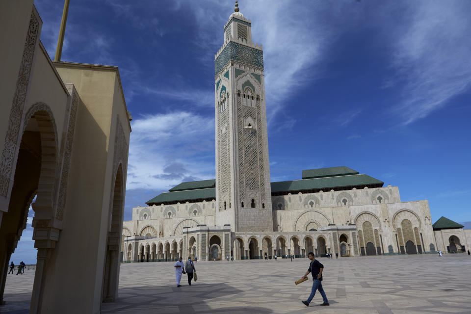 Moroccans wear face masks and pray respecting social distancing at the great Hassan II Mosque in Casablanca, Morocco, Friday, Oct. 16, 2020. In Morocco today, around 10,000 mosques have opened their doors for the faithful to perform the Friday. For the first time since the outbreak of coronavirus in March, Morocco has allowed mosques to reopen for Friday prayers. (AP Photo / Abdeljalil Bounhar)