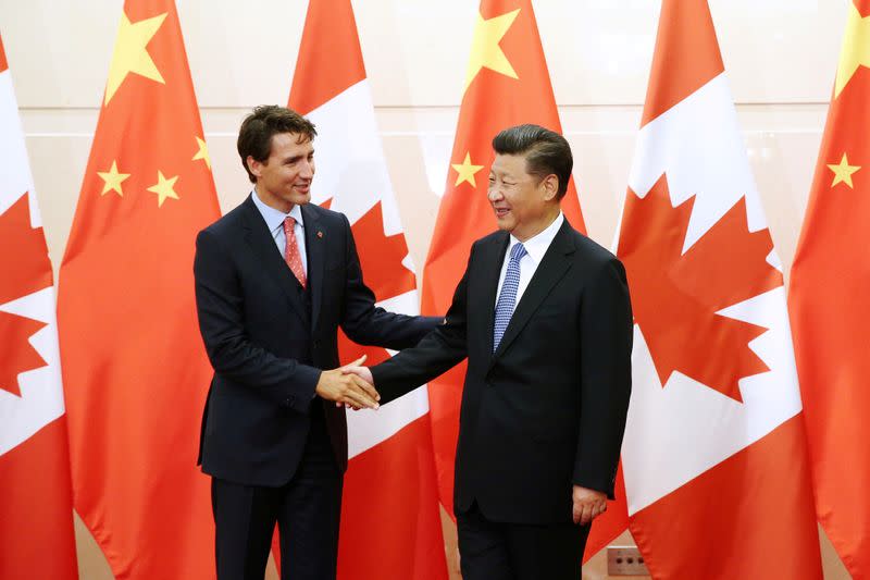 FILE PHOTO: Chinese President Xi Jinping shakes hands with Canadian Prime Minister Trudeau ahead of their meeting at the Diaoyutai State Guesthouse in Beijing