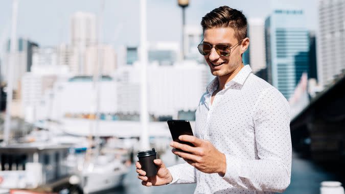 Businessman going for a coffee break to yacht club