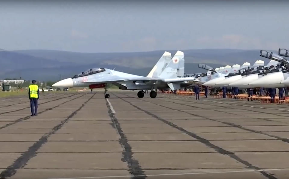 <em>A Russian prepares to take off during the military exercises during the Vostok 2018 exercises in Russia (AP)</em>